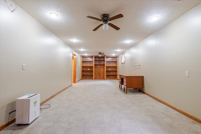 201 N Broadway St, Hudson, IL 61748 - unfurnished room with a ceiling fan, light colored carpet, built in shelves, recessed lighting, and a textured ceiling