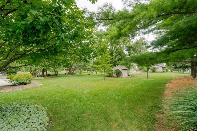 201 N Broadway St, Hudson, IL 61748 - view of grassy yard featuring an outdoor structure