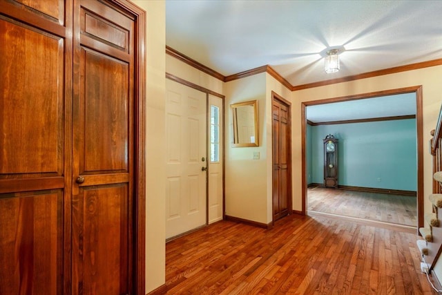 201 N Broadway St, Hudson, IL 61748 - hall featuring hardwood / wood-style flooring and crown molding