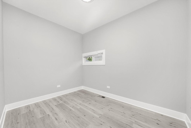 819 E 98th Pl, Chicago, IL 60628 - empty room with light wood-style flooring and lofted ceiling