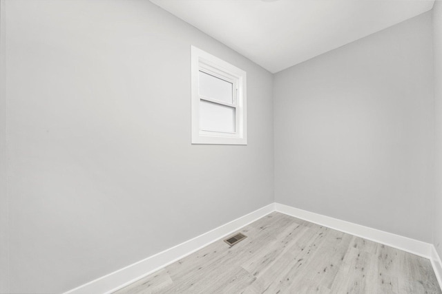 819 E 98th Pl, Chicago, IL 60628 - unfurnished room featuring baseboards and light wood-type flooring