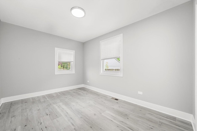 819 E 98th Pl, Chicago, IL 60628 - spare room with baseboards and light wood-style floors