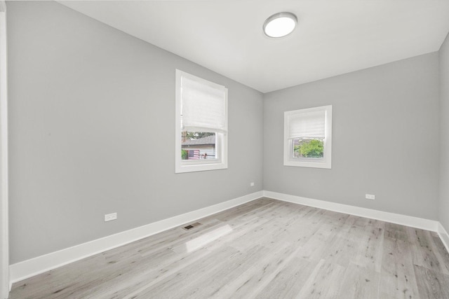 819 E 98th Pl, Chicago, IL 60628 - unfurnished room with plenty of natural light and light wood-type flooring