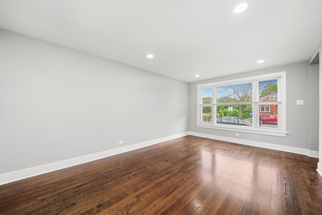 819 E 98th Pl, Chicago, IL 60628 - unfurnished room featuring dark wood-style flooring and recessed lighting