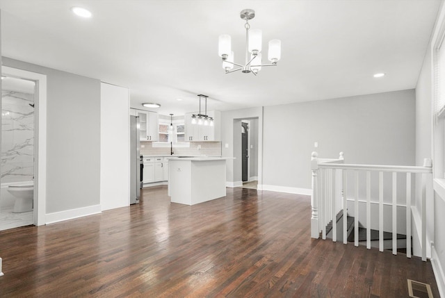 819 E 98th Pl, Chicago, IL 60628 - living room featuring a chandelier, dark wood-style flooring, and recessed lighting