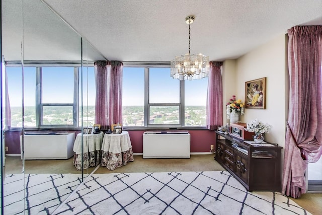 3925 Triumvera Dr Unit 14D, Glenview, IL 60025 - dining room featuring light carpet, a chandelier, and a textured ceiling