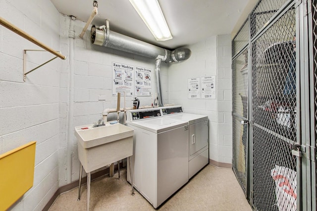 3925 Triumvera Dr Unit 14D, Glenview, IL 60025 - shared laundry room with washer and clothes dryer and concrete block wall