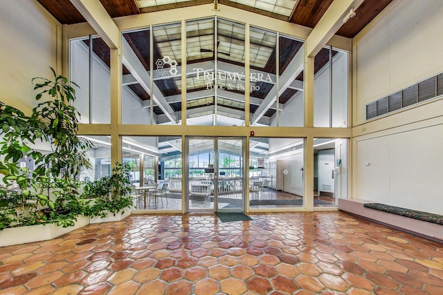 3925 Triumvera Dr Unit 14D, Glenview, IL 60025 - lobby featuring high vaulted ceiling and beam ceiling
