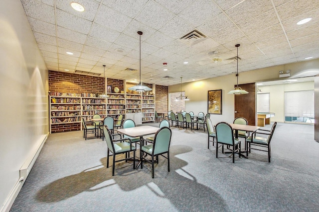 3925 Triumvera Dr Unit 14D, Glenview, IL 60025 - dining space with carpet, a baseboard radiator, and a drop ceiling