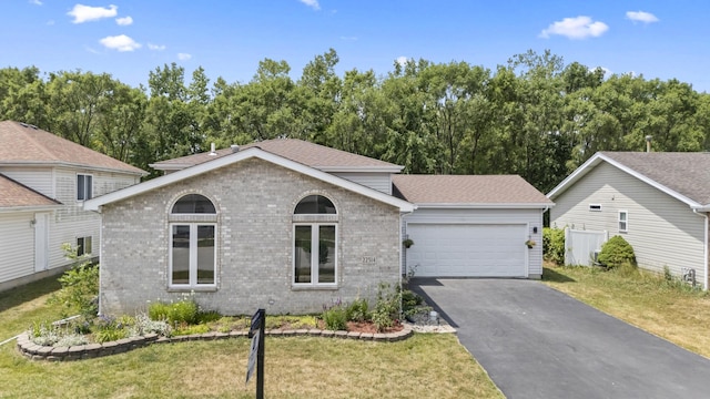 22514 Plum Creek Dr, Sauk Village, IL 60411 - view of front of property featuring brick siding, driveway, a garage, a front yard, and a shingled roof