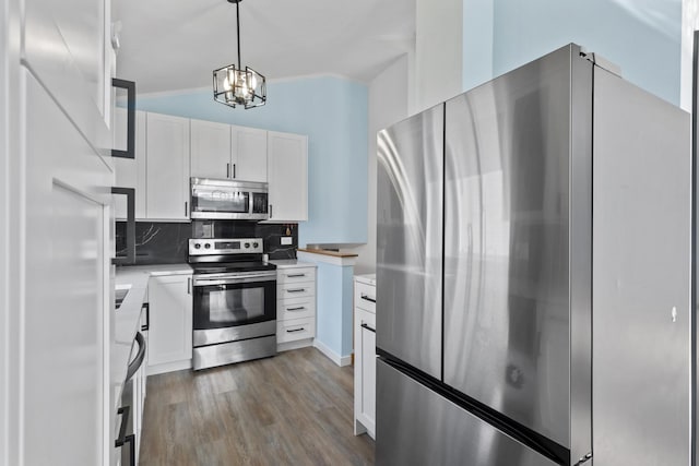 22514 Plum Creek Dr, Sauk Village, IL 60411 - kitchen with stainless steel appliances, white cabinets, decorative backsplash, dark wood-type flooring, and light countertops
