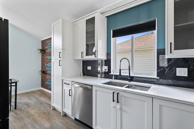 22514 Plum Creek Dr, Sauk Village, IL 60411 - kitchen featuring dishwasher, decorative backsplash, white cabinets, glass insert cabinets, and light wood-style flooring