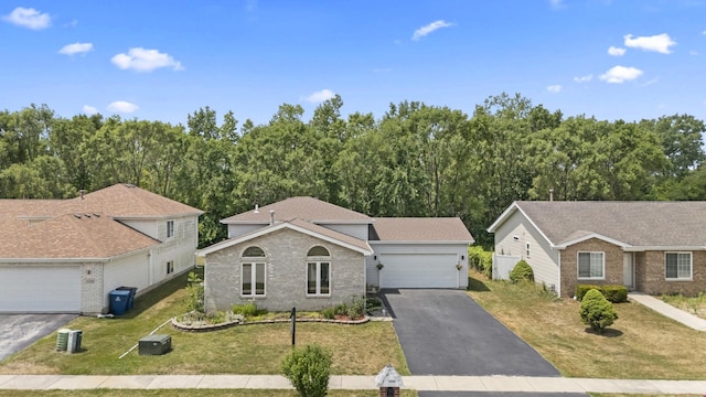 22514 Plum Creek Dr, Sauk Village, IL 60411 - view of front facade with a front yard and brick siding