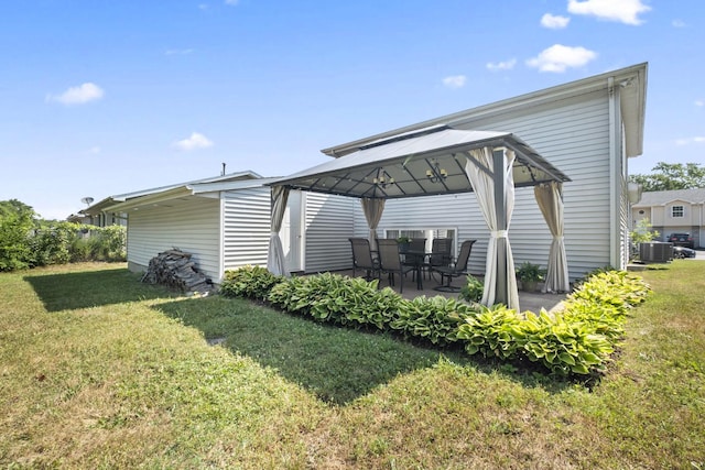 22514 Plum Creek Dr, Sauk Village, IL 60411 - view of side of property with a gazebo, a yard, and a patio area