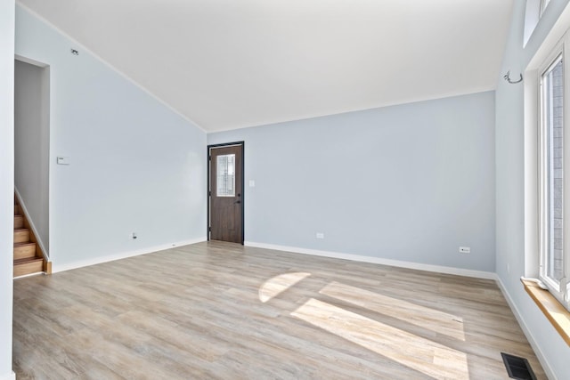 22514 Plum Creek Dr, Sauk Village, IL 60411 - spare room with lofted ceiling and light wood-style flooring