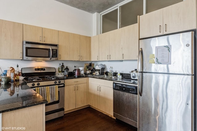 235 W Van Buren St Unit 1705, Chicago, IL 60607 - kitchen with stainless steel appliances, light brown cabinetry, dark wood finished floors, and dark stone countertops