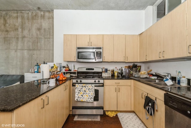 235 W Van Buren St Unit 1705, Chicago, IL 60607 - kitchen featuring appliances with stainless steel finishes, light brown cabinets, a peninsula, dark stone countertops, and light wood finished floors