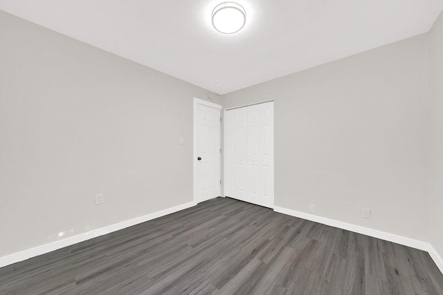 17841 Lorenz Ave, Lansing, IL 60438 - spare room featuring dark wood-type flooring and baseboards