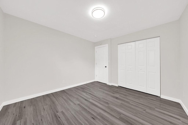 17841 Lorenz Ave, Lansing, IL 60438 - unfurnished bedroom with wood finished floors and a closet