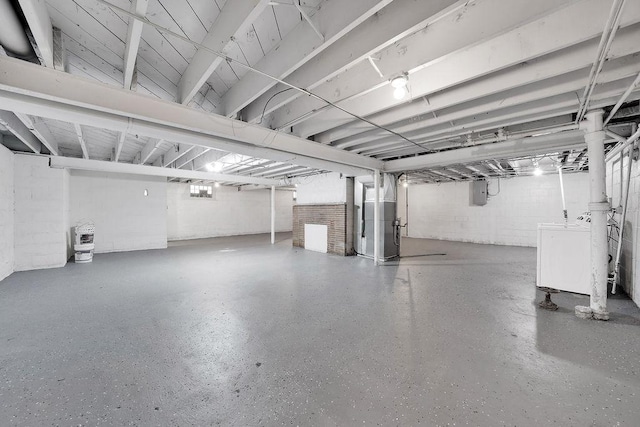 17841 Lorenz Ave, Lansing, IL 60438 - unfinished basement featuring washer / dryer, electric panel, concrete block wall, and heating unit