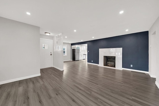 17841 Lorenz Ave, Lansing, IL 60438 - unfurnished living room with wood finished floors, a premium fireplace, and recessed lighting