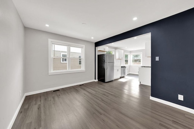 17841 Lorenz Ave, Lansing, IL 60438 - unfurnished living room with dark wood-style floors and recessed lighting