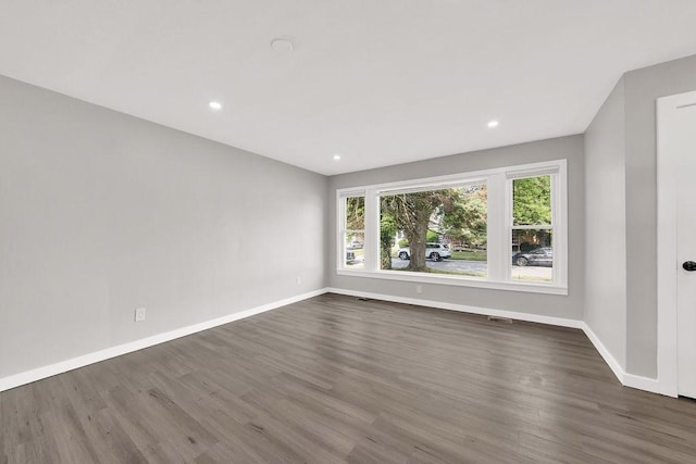 17841 Lorenz Ave, Lansing, IL 60438 - empty room featuring dark wood-style floors and recessed lighting