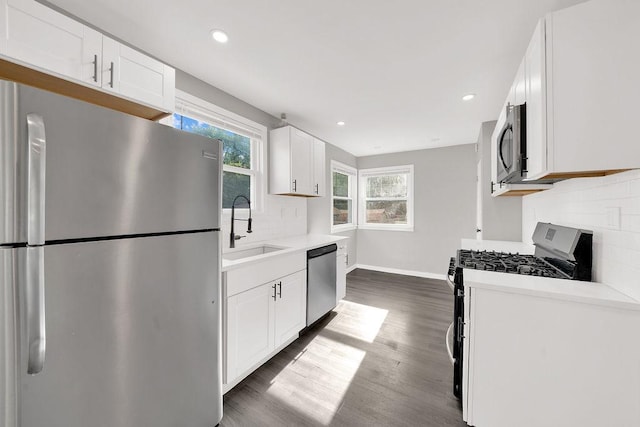 17841 Lorenz Ave, Lansing, IL 60438 - kitchen with appliances with stainless steel finishes, light countertops, white cabinets, tasteful backsplash, and recessed lighting