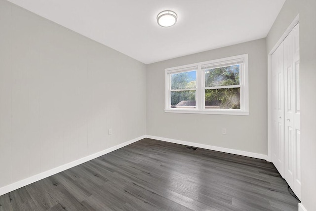 17841 Lorenz Ave, Lansing, IL 60438 - unfurnished bedroom featuring dark wood-type flooring and a closet