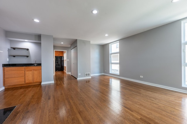937 W Wrightwood Ave Unit C, Chicago, IL 60614 - unfurnished living room featuring dark wood-style flooring and recessed lighting
