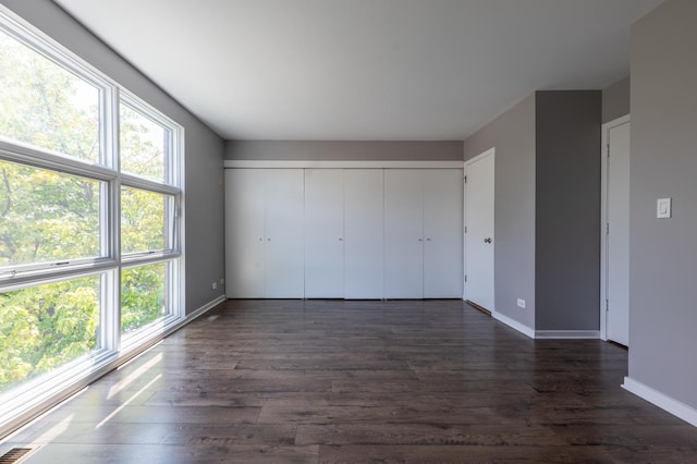 937 W Wrightwood Ave Unit C, Chicago, IL 60614 - unfurnished bedroom featuring dark wood-type flooring and a closet