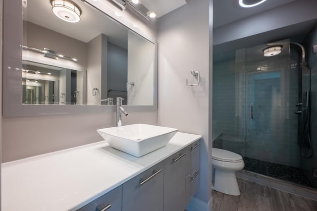 937 W Wrightwood Ave Unit C, Chicago, IL 60614 - bathroom with a stall shower, vanity, and wood finished floors