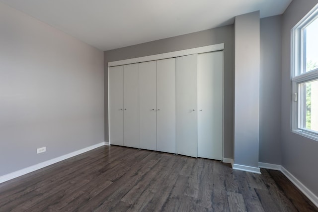 937 W Wrightwood Ave Unit C, Chicago, IL 60614 - unfurnished bedroom with dark wood-style floors and a closet