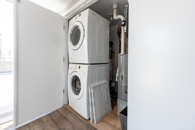 937 W Wrightwood Ave Unit C, Chicago, IL 60614 - washroom with estacked washer and dryer and wood finished floors
