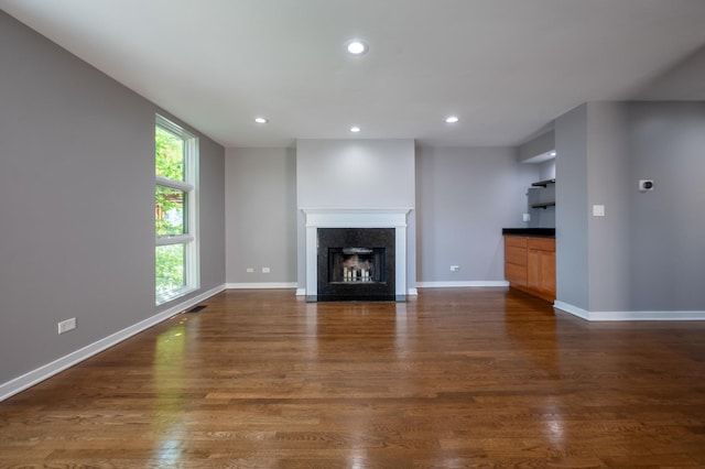 937 W Wrightwood Ave Unit C, Chicago, IL 60614 - unfurnished living room featuring recessed lighting, dark wood-style floors, and a premium fireplace