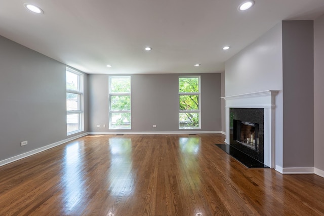 937 W Wrightwood Ave Unit C, Chicago, IL 60614 - unfurnished living room featuring wood finished floors, a premium fireplace, and recessed lighting