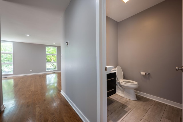 937 W Wrightwood Ave Unit C, Chicago, IL 60614 - bathroom featuring wood finished floors, vanity, and recessed lighting