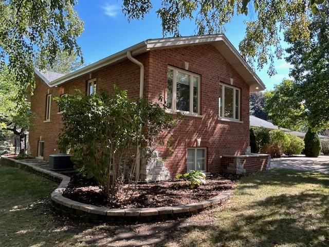 2277 S Westwood Ln, Palatine, IL 60067 - view of side of home with brick siding and a lawn