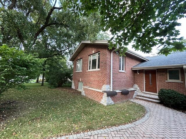 2277 S Westwood Ln, Palatine, IL 60067 - view of side of home featuring brick siding and a yard