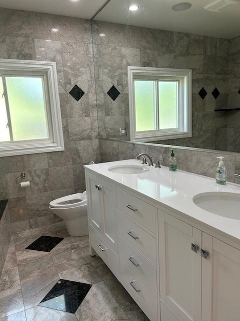 2277 S Westwood Ln, Palatine, IL 60067 - full bath featuring double vanity and tile walls