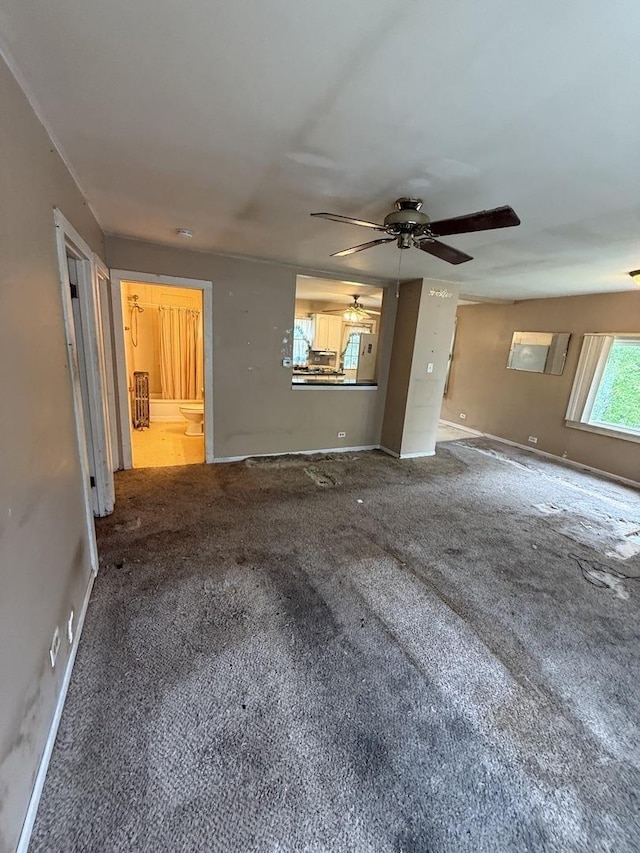 526 Grandview Dr, Round Lake Park, IL 60073 - unfurnished living room with carpet floors and a ceiling fan