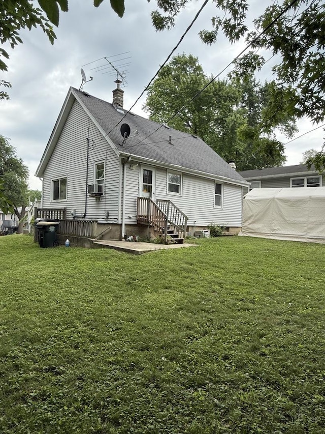526 Grandview Dr, Round Lake Park, IL 60073 - rear view of property with a chimney, a yard, cooling unit, and roof with shingles