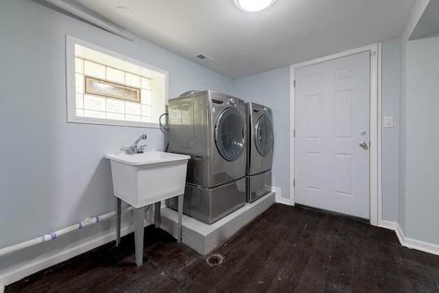 9340 S Elizabeth St, Chicago, IL 60620 - laundry area with washer and dryer and wood finished floors