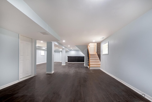9340 S Elizabeth St, Chicago, IL 60620 - below grade area with dark wood finished floors, stairway, and recessed lighting