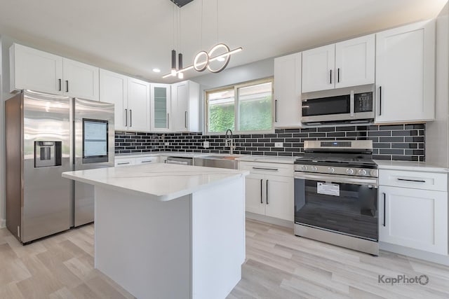 9340 S Elizabeth St, Chicago, IL 60620 - kitchen with stainless steel appliances, light countertops, white cabinets, and recessed lighting