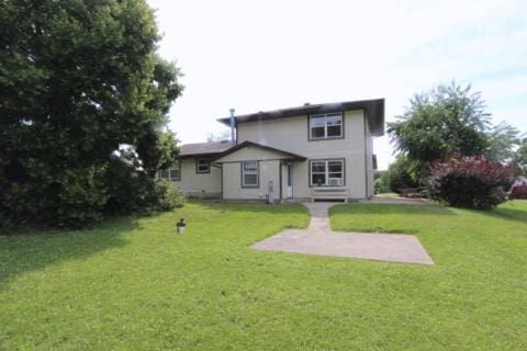 8315 Nolan St, Harvard, IL 60033 - rear view of property with a yard