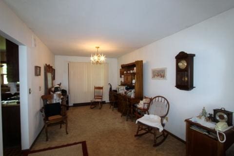 8315 Nolan St, Harvard, IL 60033 - living area featuring a chandelier and carpet