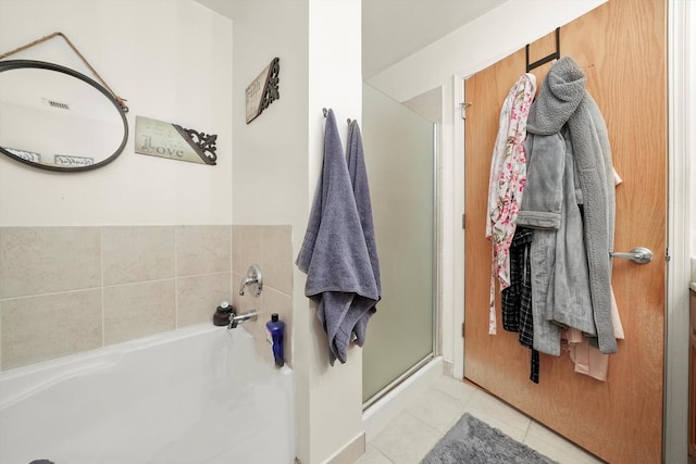 41 E 8th St Unit 1404, Chicago, IL 60605 - full bath featuring a garden tub, a shower stall, and tile patterned flooring