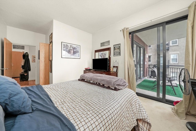 41 E 8th St Unit 1404, Chicago, IL 60605 - bedroom with access to exterior and light carpet