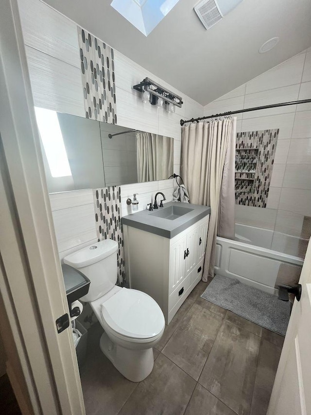 5428 138th St, Crestwood, IL 60418 - full bath featuring a skylight, vanity, shower / tub combo, vaulted ceiling, and wood finished floors